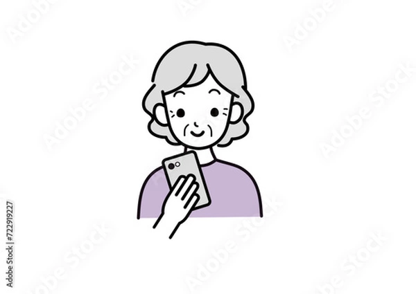 Fototapeta 笑顔でスマホほ見るシニア女性