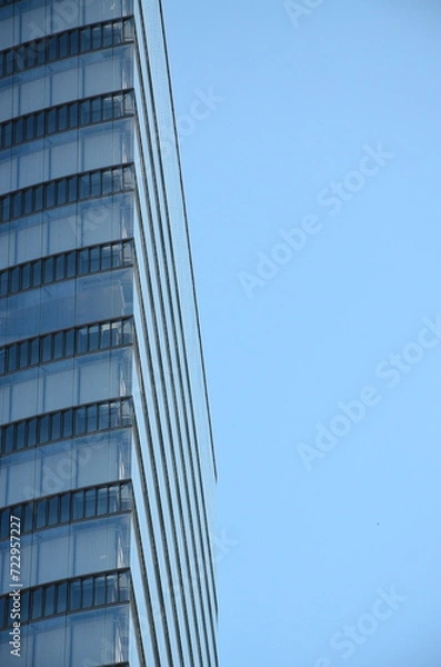 Fototapeta Reflection of the building in the windows of a modern office building