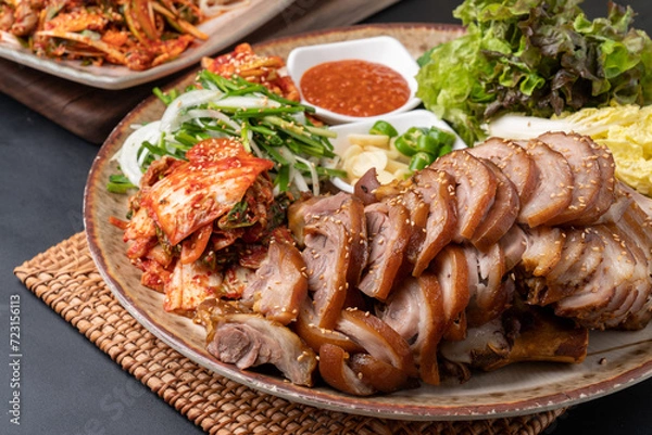 Obraz Steamed pork feet, jokbal, spicy pork feet, sea snail, seasoned spicy fish, tray noodles, Korean food, traditional food, pork