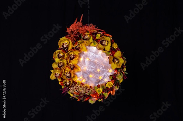 Fototapeta orchids decorative in round shape with silky center and star lighting on black background