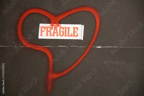 Obraz Fragile text inscribed in a hand-painted red heart