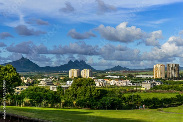 Fototapeta Moka mountain range and its summit Pieter Both viewed from a green park of a residential area of the town of Quatre Bornes, Mauritius