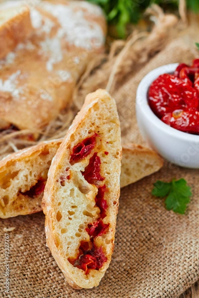 Fototapeta Fresh bread ciabatta with sun dried tomatoes