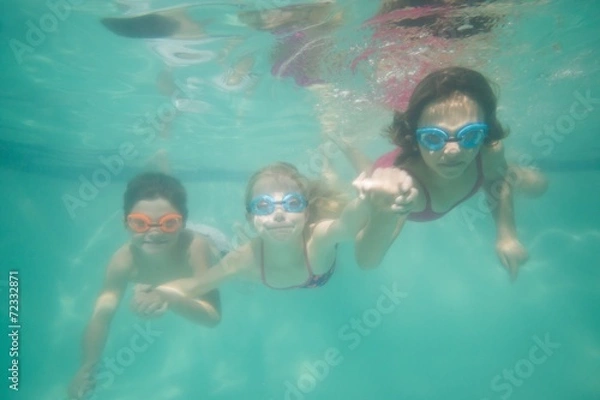 Obraz Cute kids posing underwater in pool