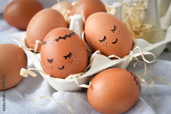 Obraz Happy Easter! Easter eggs on a rustic table in a cardboard box