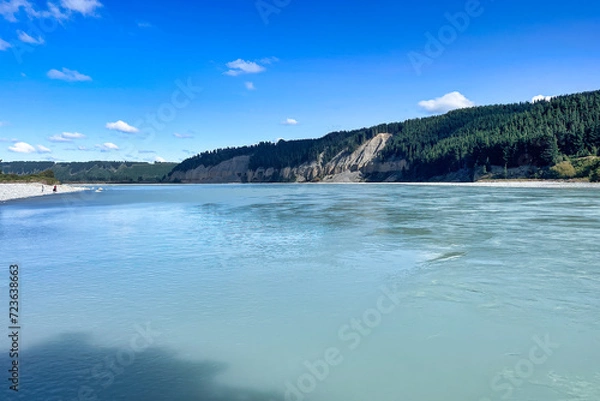Obraz The clean turquoise blue water in the river as it flows under the bridge at the Rakaia Gorge