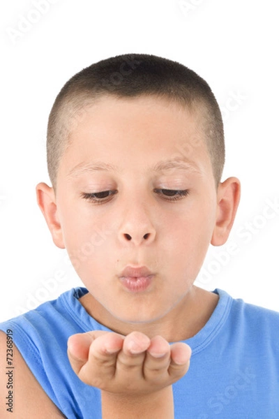 Fototapeta Adorable child sending a kiss a over white background