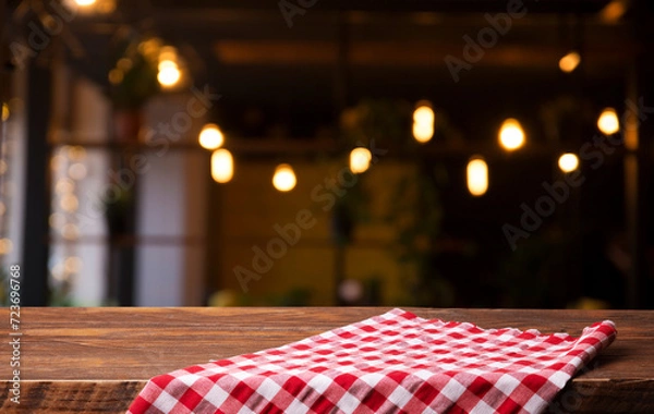 Obraz empty table to showcase your product, against the background of a blurred cafe golden bokeh. High quality photo