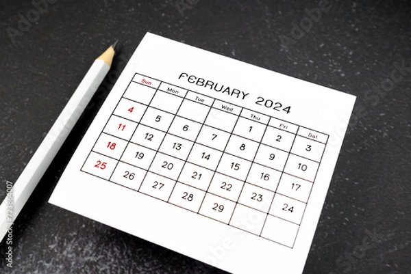 Obraz White calendar page for February 2024 and pencil on black.