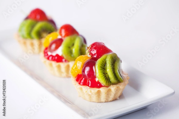 Obraz three baskets of fruit on a plate