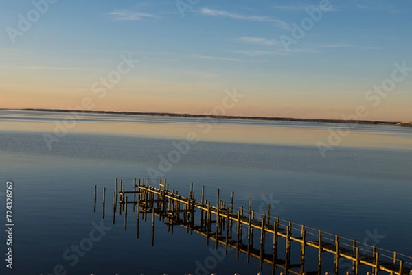 Fototapeta sunset reflected over the lake