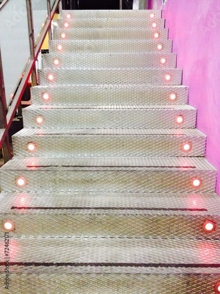 Fototapeta Flight of metal stairs with light