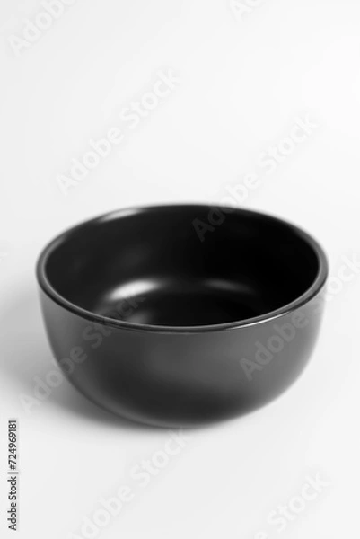 Fototapeta Black bowl of food on a white background