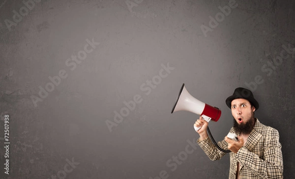 Obraz Guy shouting into megaphone on copy space background