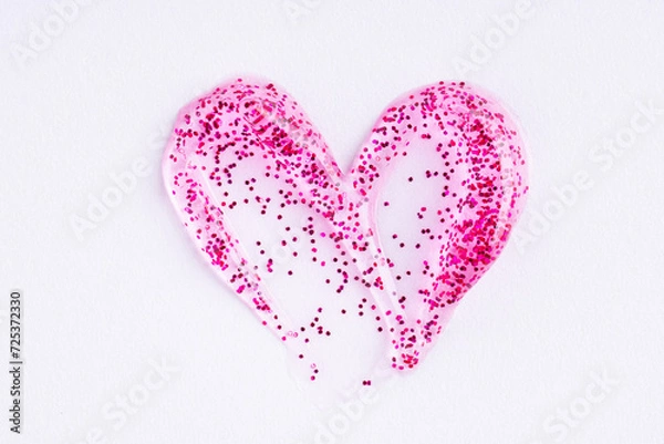 Obraz Pink shimmering lip gloss texture in heart shape, texture stroke isolated on white background. Glittering sample