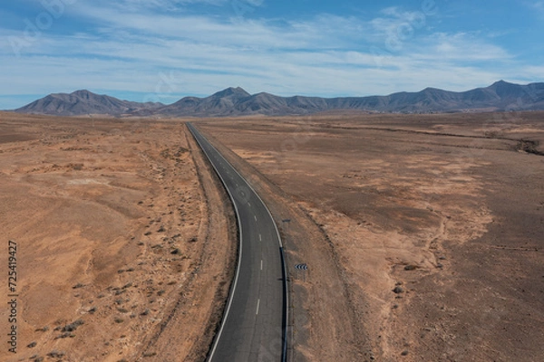 Fototapeta aerial view of a desert road on Fuerteventura