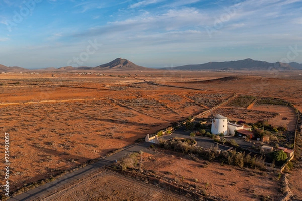 Fototapeta aerial view on a spanish windmill on the island of fuerteventura