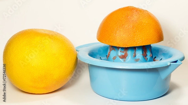 Obraz Grapefruit juice squeezing process