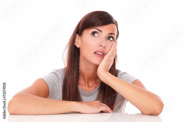 Obraz Reflective woman wondering while looking up