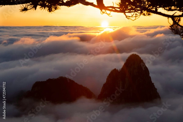 Fototapeta The sun sets on the Sea of Clouds in the North Sea area of Huangshan's Yellow Mountains.