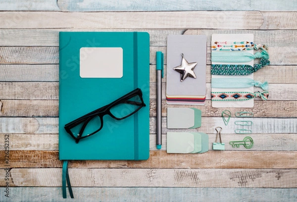 Obraz Notepad with pen and paper clips