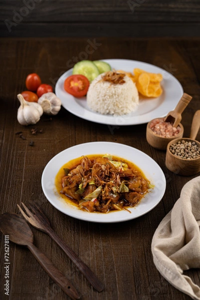 Obraz Chicken Tongseng or Tongseng ayam is an Indonesian meat or mutton stew dish in curry like soup with coconut milk, chili and sweet soy sauce. 