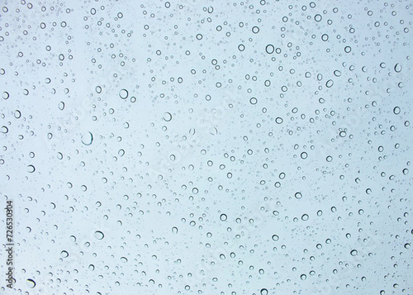 Fototapeta The background of rain drops on the car windshield is the sky.