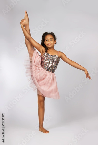 Obraz Image of flexible little girl doing vertical split