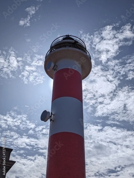Obraz lighthouse on a blue sky
