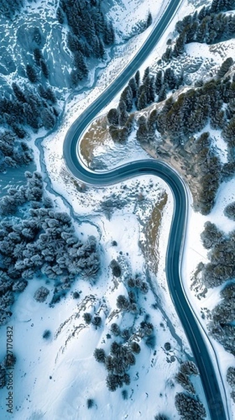 Fototapeta Aerial view of the winding Snake Road in winter in the Dolomite Alps of Italy