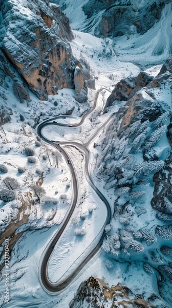 Fototapeta Aerial view of the winding Snake Road in winter in the Dolomite Alps of Italy