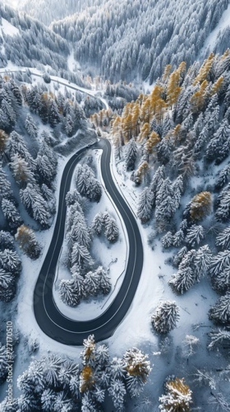 Fototapeta Aerial view of the winding Snake Road in winter in the Dolomite Alps of Italy