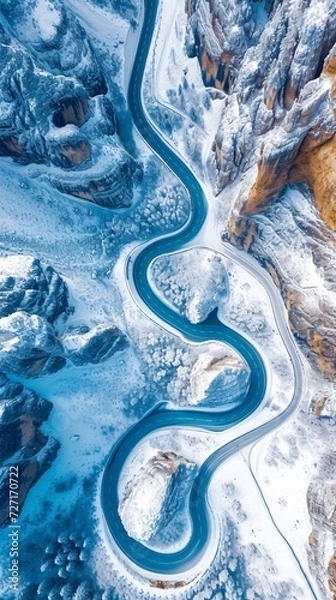 Fototapeta Aerial view of the winding Snake Road in winter in the Dolomite Alps of Italy