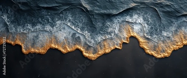 Fototapeta Aerial View of a Beach With Waves and Sand
