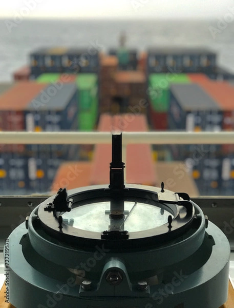 Fototapeta Closeup view of compass with azimuth circle fitted in the bridge of a merchant ship at sea