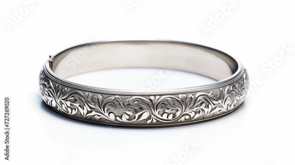 Fototapeta A single silver bracelet with intricate details isolated on white