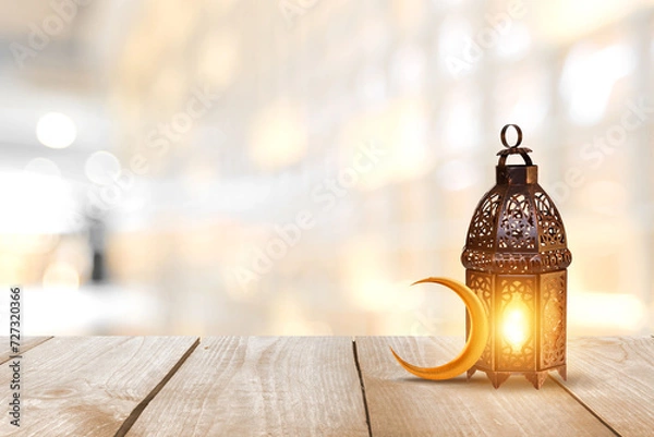 Obraz Ornamental Arabic lantern with burning candle glowing . Festive greeting card, invitation for Muslim holy month Ramadan Kareem. Ramadan Kareem greeting photo with serene mosque background.
