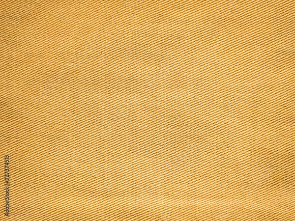 Fototapeta old khadi fabric texture background. light natural linen texture for the background.Golden yellow linen fabric of table cloth texture background.