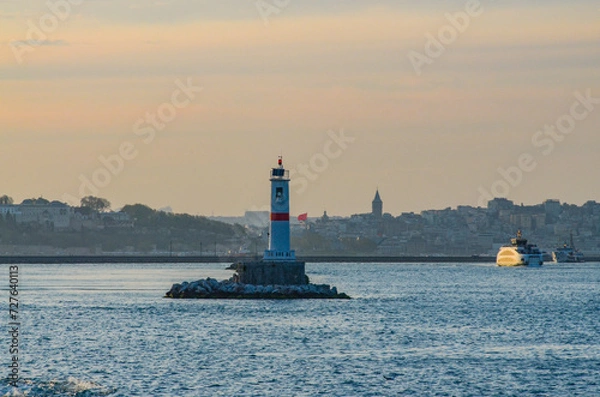 Fototapeta lighthouse in Kadikoy harbor on Anatolian side of Istanbul evening view