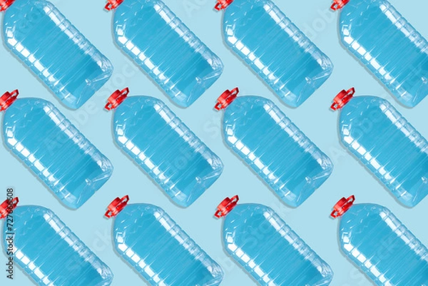 Fototapeta Lot of plastic bottles on a blue background. Products, packaging, storage.