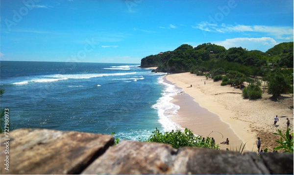 Obraz Photo of a very beautiful landscape of Drini Beach and Drini Hill in blue shades, one of the favorite tourist destinations in Yogyakarta, Indonesia