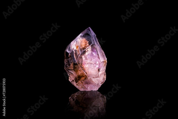 Fototapeta smoky quartz with amethyst part photography isolated on black background. from erongo, Namibia. macro detail close-up rough raw unpolished semi-precious gemstone.
