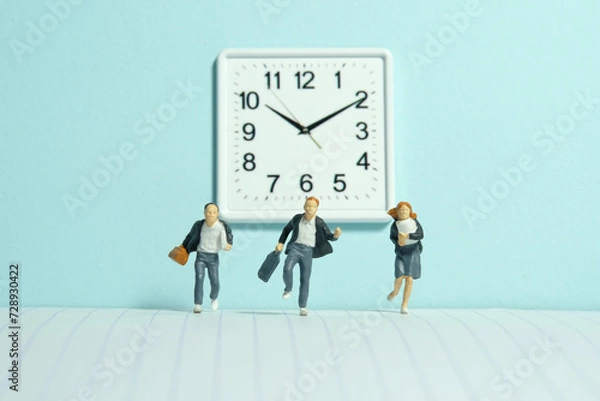 Fototapeta Miniature tiny people toy photography. A group of pupils running in the school hallway, late for class