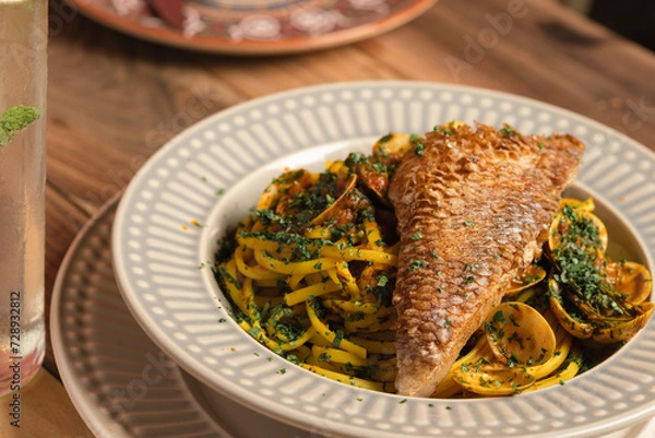 Obraz italian pasta with fish on top