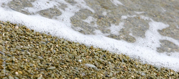 Fototapeta diagonal image of bebbles and water