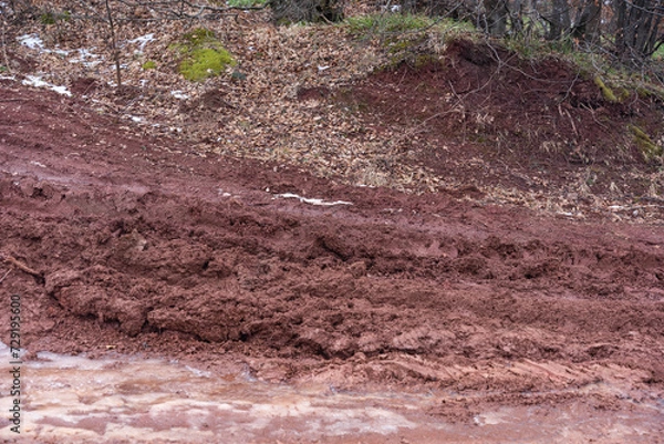 Fototapeta Contamination of soil and nature by mining dangerous and toxic ores from the ground, deposits of red matter and dust, destruction of natural habitat and natural disaster