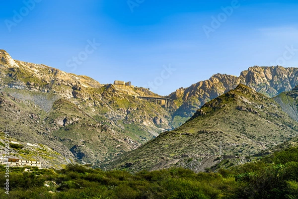 Fototapeta Landscape view of Mountains with bridge from the valley,  from Al Hada , Taif ,Saudi Arabia