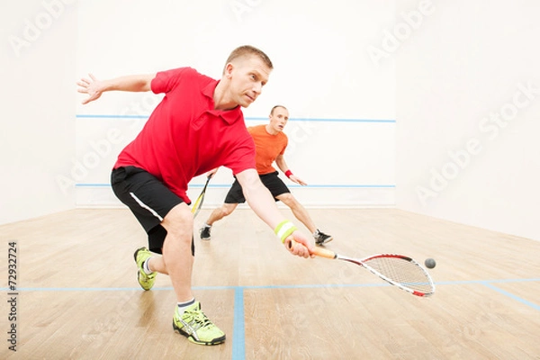 Obraz Two men playing match of squash.