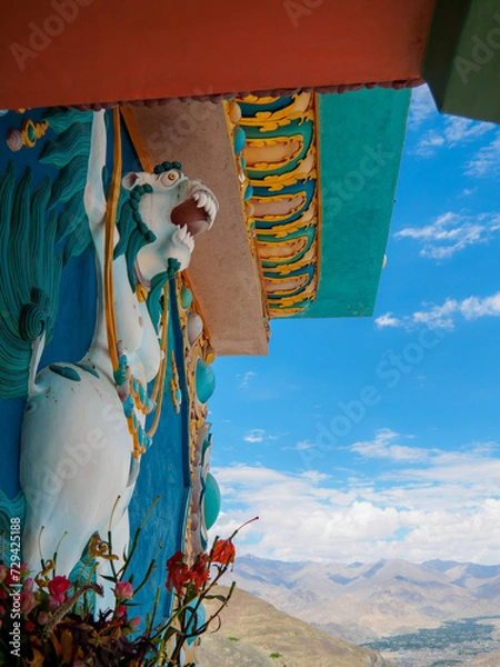 Obraz Close-up high relief sculpture of mythical creature in Tibetan style - Snow Lion, adorned around the base of golden Buddha Statue at Stok Village.