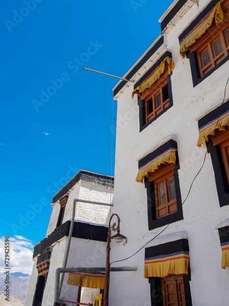 Obraz Old buildings in Tibetan architecture style of Namgyal Tsemo Gompa Monastery, window color attractively contrast against white wall. 